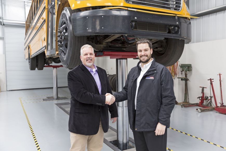 Matthias Lennemann and Screven School System handshake